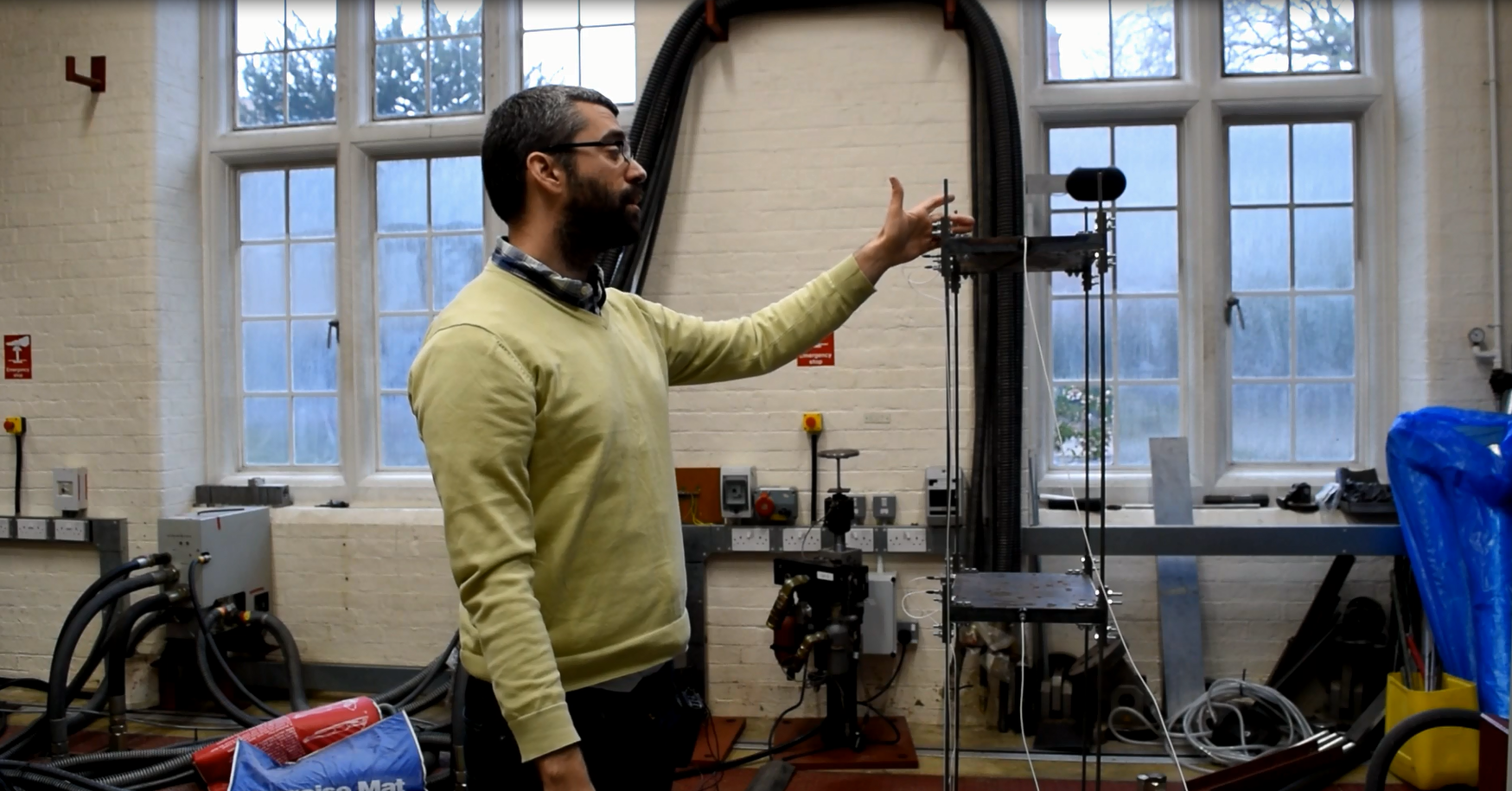 Man demonstrating shake table at Oxplore event